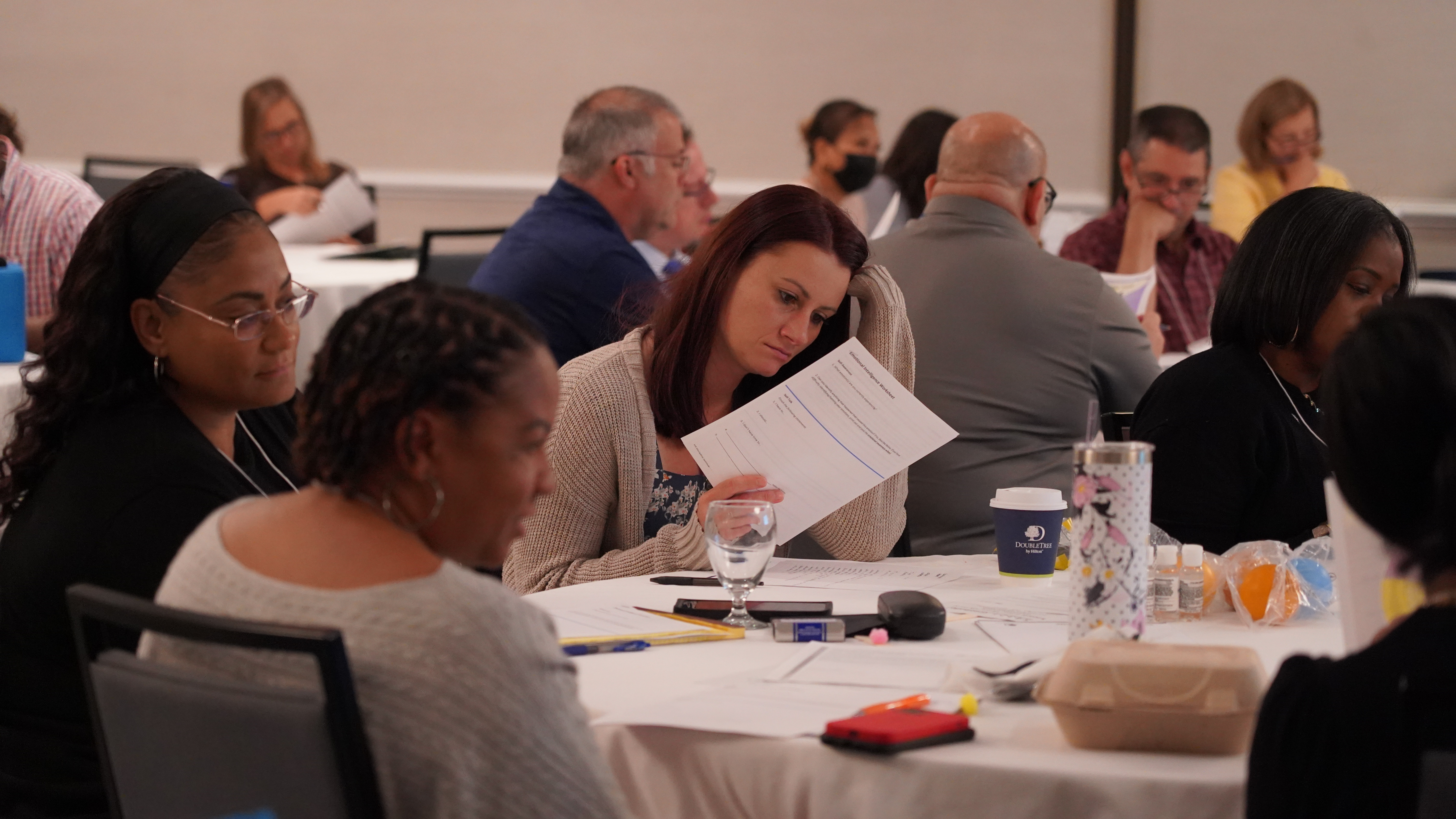Seminar attendee looking at event paperwork.